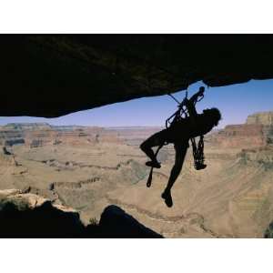  A Climber Uses Aid to Scale an Overhang on the South Rim 