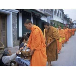 Novice Buddhist Monks Collecting Alms of Rice, Luang Prabang, Laos 