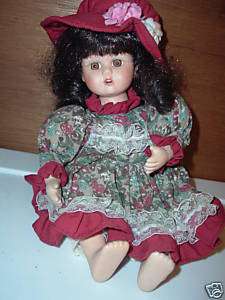 ANCO DOLL PORCELAIN, WIND UP ARMS MOVE & PLAYS SONG  