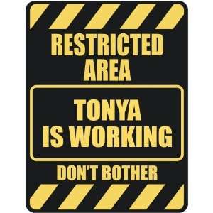   RESTRICTED AREA TONYA IS WORKING  PARKING SIGN