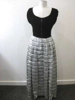   Elastic cap sleeves black glass buttons down the back Flared skirt