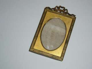 Small antique gilt bronze / brass photograph frame with stand. Late 