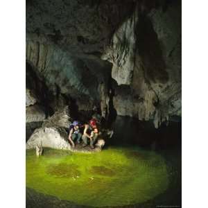 Two Spelunkers Prepare to Release Dye into a Caves Waterway Premium 