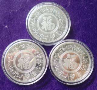 Three (3) chromatic commemorative silver coins year of dragon  