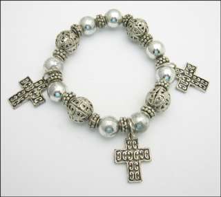   charm bracelet this bracelet has silvertone metal beads and three