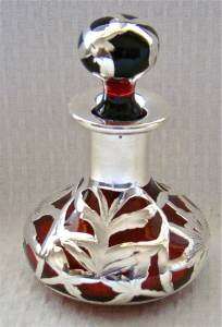   for action is a perfume bottle that is ruby or cranberry red in color
