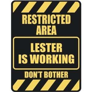   RESTRICTED AREA LESTER IS WORKING  PARKING SIGN