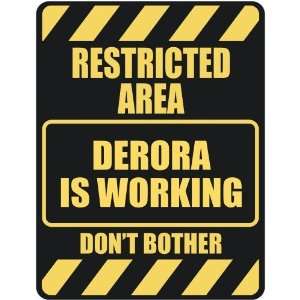   RESTRICTED AREA DERORA IS WORKING  PARKING SIGN