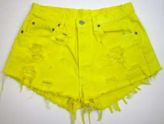   yellow dyed with winking smiley printed on back with the pocket ripped