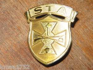 Original Vintage US Army ROTC St. Thomas Military Academy hat badge 