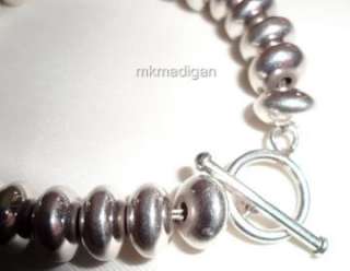   silver oval beads bracelet with toggle clasp closure packaged in