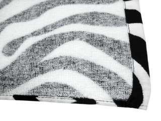 fiber reactive velour beach towel has a zebra stripe print. The towel 