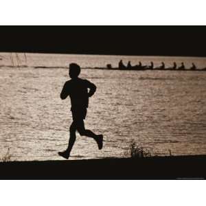  Silhouette of a Jogger Next to Water National Geographic 