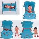 VINTAGE RUBBER DOLL IN WOODEN BED CRADLE