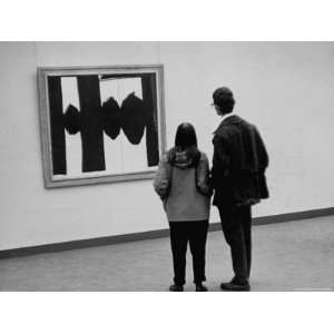 People Looking at a Painting by Robert Motherwell at an American Art 