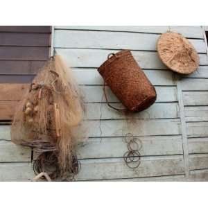 Hat, Basket, and Fishing Net Hanging Outside Iban Longhouse, Sarawak 