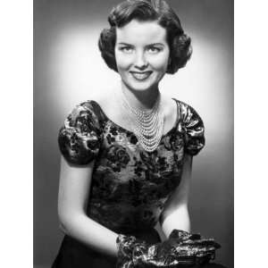  Woman Wearing Pearls, Dress, and Matching Gloves 